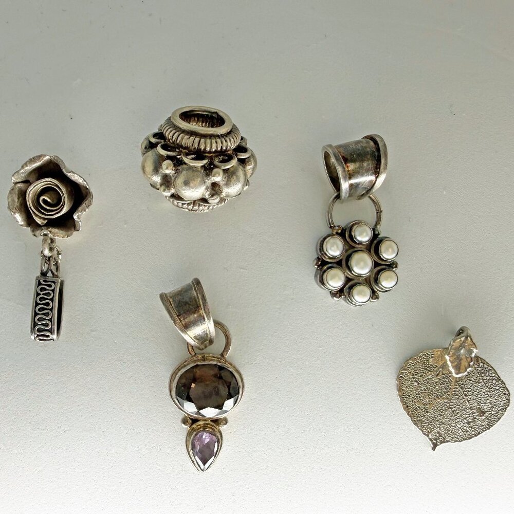 MISCELLANEOUS BALI SILVER AND STERLING SILVER PENDANTS AND SLIDER